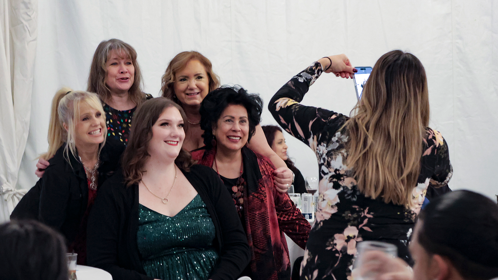a group of ladies posing for a photo.