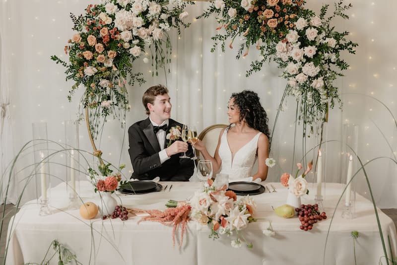 Bride and groom toasting at their wedding reception at Creekside at Haggin Oaks.